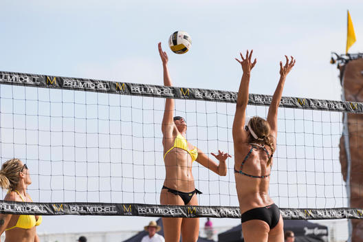 Professional Beach Volleyball Players in action