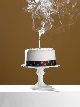 Extinguished birthday candle on birthday cake