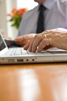 Close up of woman hands typing on a computer keyboard