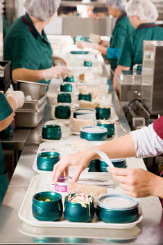 Workers Preparing Meal For Patients