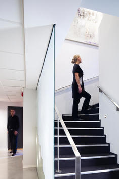 Worker ascending stairs at Kluge Attorneys Office, designed by HLM Arkitektur AS, Bergen, Norway.