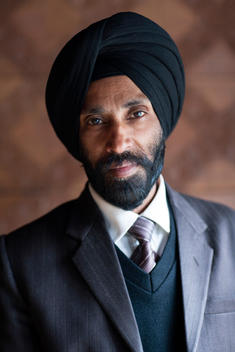 A portrait of a Sikh man wearing a turban