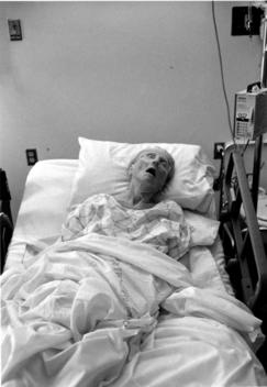 Elderly Woman On Hospital Bed
