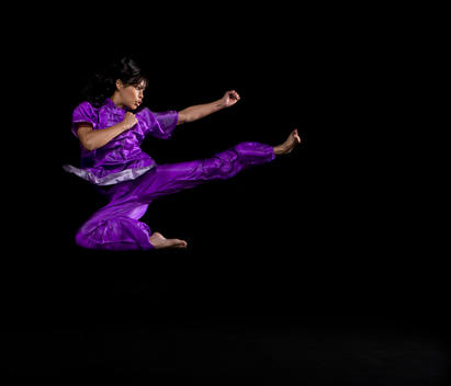 Asian woman practicing martial arts