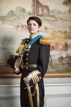 lady wearing a british navy captain uniform from the 20\'s