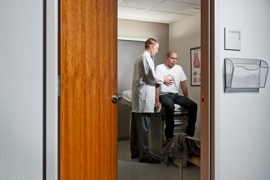 exam room with patient and male doctor