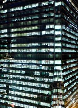 Office Building In Hong Kong Lit Up At Night, China.
