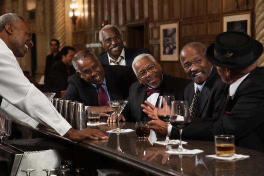 African American men drinking at bar