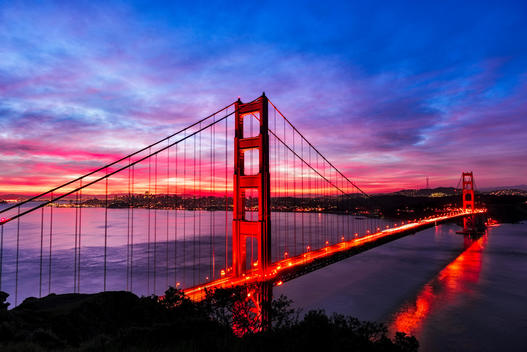 Golden Gate Bridge lit up at sunset, San Francisco, California, United States