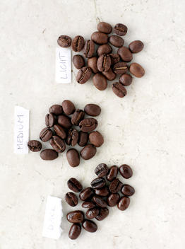 Piles Of Labeled Coffee Beans