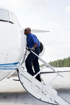 Technician Boarding Private Jet, Treasure Cay, Bahamas.