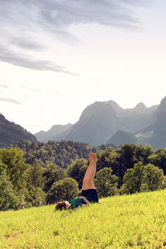Young woman relaxing and overlooking the alps