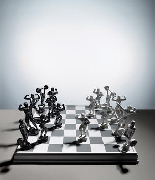 Fitness statues on chess board