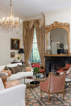 Antique Furniture And Luxurious Furnishings Decorate The Living Room Of A Mansion
