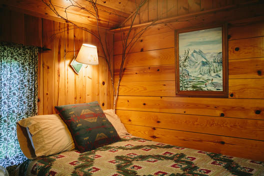 Interior of one room Adirondack cabin at the Mt. Van Hoevenberg bed and breakfast.