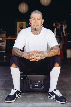 Portrait of man with tattoos.