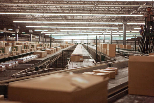 Boxes on conveyor belt at a sorting facility/distribution warehouse.