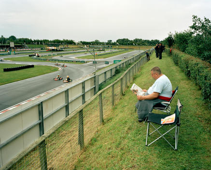 A Spectator Finds A Quieter Viewpoint Where He Can Read The Newspaper During The Msa British Short Circuit Kartmasters Grand Prix, Pf International Circuit, Trent Valley Kart Club.
