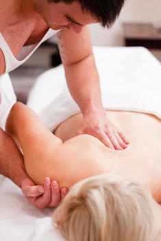 Masseur giving a woman a massage