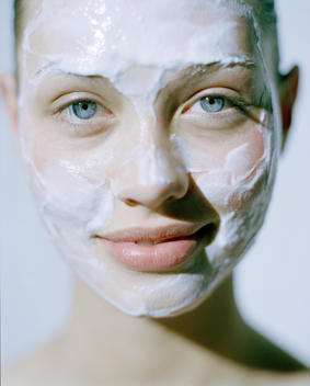 Beauty Model With Skin Cream Face Mask