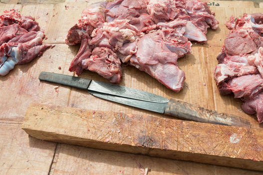 Meat and knives on carving board