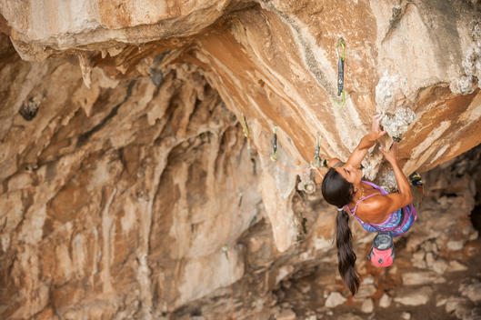 Professional climber Daila Ojeda climbing an hard route during San Vito Climbing Festival 2014, where she was invited as special guest. Sicily, Italy.