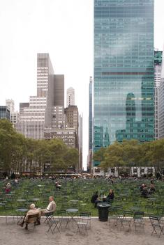 Bryant Park filled with mostly empty chairs and tables in Manhattan