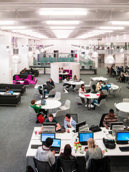 Students working in the library at London Metropolitan University designed by Cartwright Pickard Architects, London, UK.
