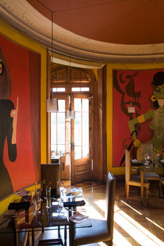 interior of a empty restaurant with wall murals