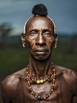 Bona Is The Highly Respected Chief Of His Village, Labaltoy. In Hamer Culture, The Name Bona Is Given To An Aggressive Dog Or Animal. It Is Not A Common Name For A Human. When He Was Young, Bona Showed Strong Signs Of Aggression And Strength, Causing His 