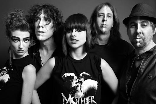 Musical group MotherFeather photographed in studio before a performance