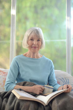 Close up of the happy serene face of an attractive senior woman of retirement age