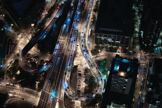 Aerial photograph of the Manhattan Bridge onramps at night.