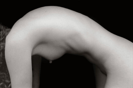 A naked woman with an arched back