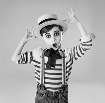 buster Keaton inspired photo shoot in black and white with boy look a like in various poses from silent movies stills