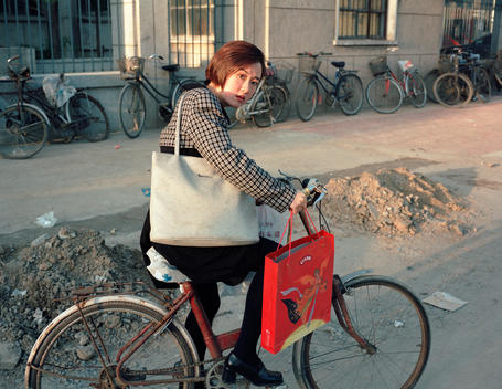 Woman on a bike, Beijing, China, 1999.