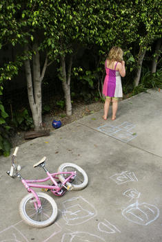 Girl plays in driveway