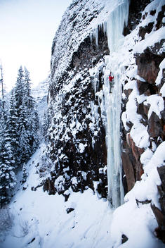 A man climbs a route called, Responsible Family Man, a frozen vertical waterfall in Montana\'s Hyalite Canyon rated at WI 5.