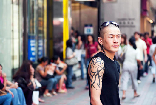 Young Man Standing In Hong Kong, China.