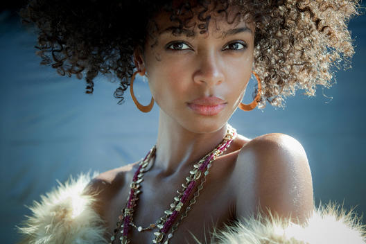 Beauty Close Up Of Dark Skin Girl With Curls And Jewels
