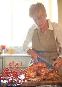 Woman craving a Thanksgiving turkey for the family in beautiful natural light