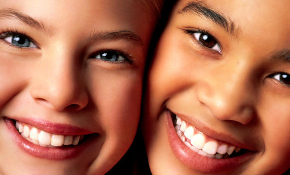 Two Young Girls Faces Side By Side