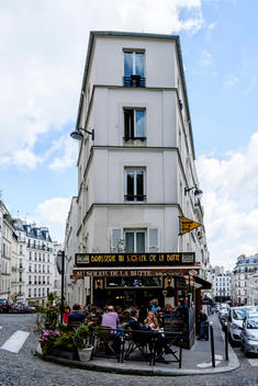 People sit outside eating at Brasserie Au Soleil De La Butte near the Basilica Sacr?-Coeur, formally known as Basilica of the Sacred Heart of Paris, on top of Montmartre in Paris, France.