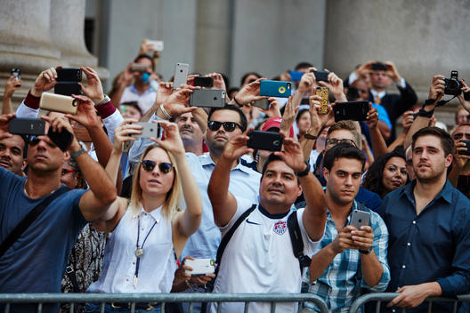 Crowd with cell phones at World Cup parade