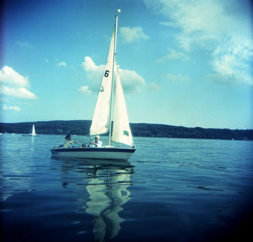 Couple Relaxing In Sailing Boat On Bavarian Lake