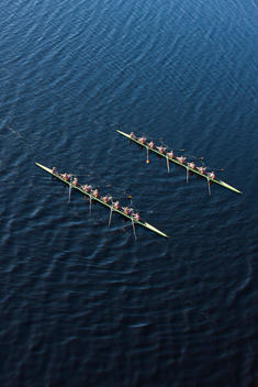 Elevated view of two rowing eights in water