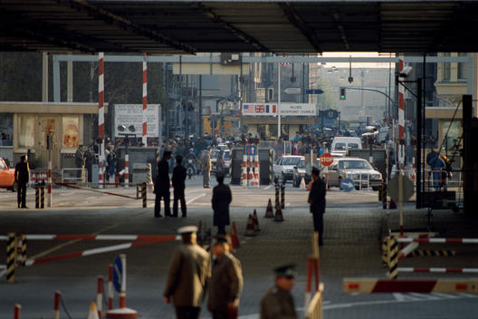 EAST BERLIN, EAST GERMANY - NOVEMBER 10, 1989 : Looking into West Berlin at the Check Point Charlie border crossing from East Berlin, Germany November 10, 1989. The East German government lifted travel and emigration restrictions to the West the night bef