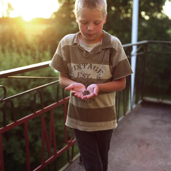 Young boy with a mouse in his hands, Lidkoping, Sweden.