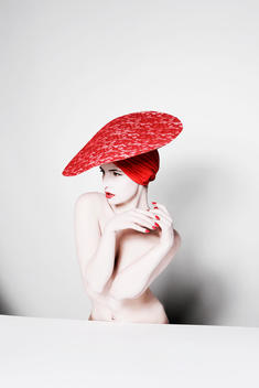 model with stylish red hat and strong red lips
