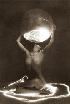 Anonymous nude woman seated, holding large, luminous, lit globe, surrounded by rings of light